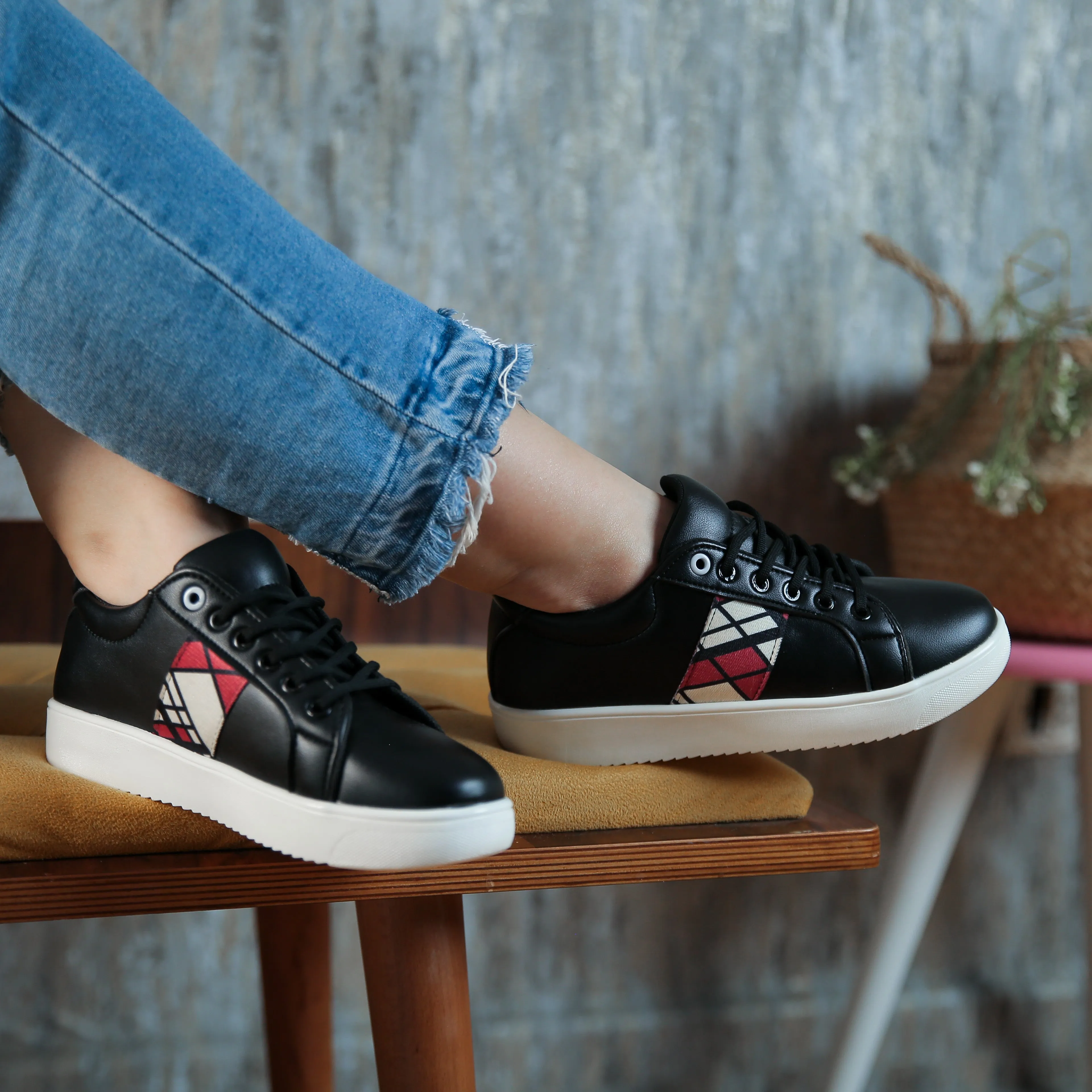 Red side black sneakers